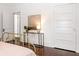 Bedroom featuring an accent table, dark wood floors, and white paneled doors at 513 Saint Charles Ne Ave, Atlanta, GA 30308