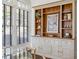 Dining area showcasing a built-in hutch with stylish decor and natural light from adjacent windows at 513 Saint Charles Ne Ave, Atlanta, GA 30308