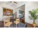 An airy dining area with built-in hutch, stylish table and connection to the kitchen at 513 Saint Charles Ne Ave, Atlanta, GA 30308