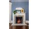 Living room featuring a cozy fireplace with decorative mantel at 513 Saint Charles Ne Ave, Atlanta, GA 30308