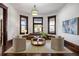 Inviting living room with natural light from the large bay windows and hardwood floors at 513 Saint Charles Ne Ave, Atlanta, GA 30308