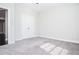 Carpeted bedroom featuring a closet and neutral walls at 223 Villa Park Cir, Stone Mountain, GA 30087