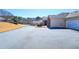 Spacious driveway leading to a well-kept home with a garage at 223 Villa Park Cir, Stone Mountain, GA 30087