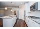 Modern kitchen featuring stainless steel appliances, granite countertops, and an island, creating a perfect culinary space at 223 Villa Park Cir, Stone Mountain, GA 30087