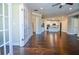 Inviting living area featuring wood floors, recessed lighting and an open layout to the kitchen creating a warm space at 223 Villa Park Cir, Stone Mountain, GA 30087