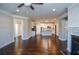 Living room showcasing open floor plan with modern kitchen and hardwood floors at 223 Villa Park Cir, Stone Mountain, GA 30087