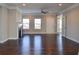 Spacious living room with hardwood floors, fireplace, natural light and crown moulding at 223 Villa Park Cir, Stone Mountain, GA 30087