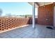 View of the patio featuring a brick accent wall and tiled flooring, perfect for outdoor relaxation and enjoyment at 223 Villa Park Cir, Stone Mountain, GA 30087