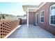 Tiled patio with brick wall provides privacy and views at 223 Villa Park Cir, Stone Mountain, GA 30087