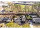 Aerial view of a home with a spacious backyard, bordered by tall trees and a baseball field at 2412 Renny Ct, Marietta, GA 30066