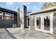 Back deck with gray finish, double glass doors, and view of the home's exterior at 2412 Renny Ct, Marietta, GA 30066