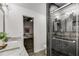 Modern bathroom featuring a glass enclosed shower, double vanity, and granite countertop at 2412 Renny Ct, Marietta, GA 30066