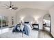 A spacious main bedroom featuring a glass sliding door and a modern ceiling fan at 2412 Renny Ct, Marietta, GA 30066