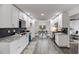 Well-lit kitchen featuring granite countertops, modern appliances, and open dining area at 2412 Renny Ct, Marietta, GA 30066