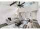 Sunlit living room featuring high ceilings, statement ceiling fan, and modern decor at 2412 Renny Ct, Marietta, GA 30066