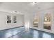 Bright sun room with white walls, tiled floors, and natural light through large windows at 2412 Renny Ct, Marietta, GA 30066