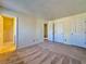 Spacious bedroom featuring plush carpet and adjacent bathroom and closet at 3533 Mulberry Way, Duluth, GA 30096