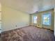 Bedroom showcasing plush carpeting, neutral walls, and sunlit windows at 3533 Mulberry Way, Duluth, GA 30096