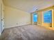 An empty bedroom featuring carpet flooring and two windows at 3533 Mulberry Way, Duluth, GA 30096