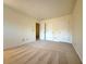 A cozy bedroom features neutral carpeting, ample closet space with three doors, and bright, neutral paint at 3533 Mulberry Way, Duluth, GA 30096