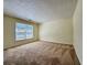 Bedroom showcasing plush carpeting, neutral walls, and sunlit windows at 3533 Mulberry Way, Duluth, GA 30096