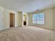 Spacious main bedroom with plush carpeting, neutral paint, and ensuite access at 3533 Mulberry Way, Duluth, GA 30096