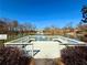 Scenic view of the community pond from a wooden platform, surrounded by lush greenery and trees at 3533 Mulberry Way, Duluth, GA 30096