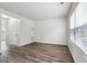 Well-lit living space featuring gray flooring, complemented by large windows and neutral walls at 4282 Worth Nw St, Acworth, GA 30101