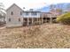 Back exterior showing the multiple decks and the backyard space at 1165 Saint Ives Ct, Suwanee, GA 30024