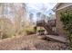 Backyard view showcasing a wooden deck with stairs down to the yard at 1165 Saint Ives Ct, Suwanee, GA 30024