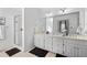 Bathroom featuring double sinks, walk-in shower, and ample counter space at 1165 Saint Ives Ct, Suwanee, GA 30024