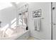 Bright bathroom features a soaking tub, natural light, and 'Relax and Unwind' decor at 1165 Saint Ives Ct, Suwanee, GA 30024