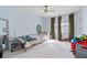 bedroom with light blue walls, plush carpeting, and a ceiling fan at 1165 Saint Ives Ct, Suwanee, GA 30024