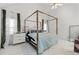 Bedroom featuring vaulted ceilings, canopy bed, large windows and ample natural light at 1165 Saint Ives Ct, Suwanee, GA 30024