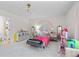Spacious bedroom with rainbow wall art, and plenty of space for activities and hobbies at 1165 Saint Ives Ct, Suwanee, GA 30024