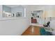 Bright entryway with hardwood floors, offering views into the living room with a cozy fireplace at 1165 Saint Ives Ct, Suwanee, GA 30024