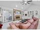 Spacious living room features a brick fireplace, built-in cabinets, and a large sectional sofa at 1165 Saint Ives Ct, Suwanee, GA 30024
