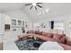 Stylish living room with a modern wet bar, vaulted ceilings, and comfortable seating, ideal for entertaining at 1165 Saint Ives Ct, Suwanee, GA 30024
