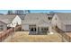 Aerial view of a backyard featuring a covered patio with outdoor seating, a fenced yard, and manicured lawn at 2764 Bateman Sw St, Powder Springs, GA 30127