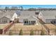 Aerial view of a backyard featuring a covered patio with outdoor seating, a fenced yard, and manicured lawn at 2764 Bateman Sw St, Powder Springs, GA 30127