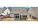 Aerial view of a backyard featuring a covered patio with outdoor seating, a fenced yard, and manicured lawn at 2764 Bateman Sw St, Powder Springs, GA 30127