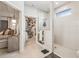 Modern bathroom with walk-in shower adjacent to a walk-in closet and main bedroom suite at 2764 Bateman Sw St, Powder Springs, GA 30127