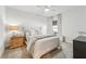 Cozy bedroom with tufted headboard, neutral tones, and ample natural light at 2764 Bateman Sw St, Powder Springs, GA 30127