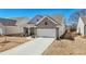 Charming stone and white siding home with a two-car garage and well-maintained landscaping in a desirable neighborhood at 2764 Bateman Sw St, Powder Springs, GA 30127