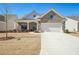 Charming single-Gathering home featuring a stone facade, two-car garage, and a cozy front porch at 2764 Bateman Sw St, Powder Springs, GA 30127