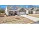 Charming home featuring stone accents, a covered porch, and a well-manicured lawn at 2764 Bateman Sw St, Powder Springs, GA 30127