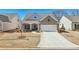 Charming home featuring stone accents, a covered porch, and a well-manicured lawn at 2764 Bateman Sw St, Powder Springs, GA 30127