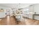 Bright kitchen featuring white cabinetry, a large center island with seating, and modern appliances at 2764 Bateman Sw St, Powder Springs, GA 30127