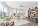 Airy living room with modern furniture, a ceiling fan, and hardwood floors at 2764 Bateman Sw St, Powder Springs, GA 30127