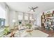 Bright living room with stylish furniture, a ceiling fan, a view of the outdoors, and wood flooring at 2764 Bateman Sw St, Powder Springs, GA 30127